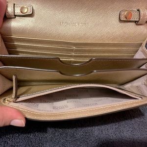 Used Michael Kors Crossbody Bag The Colors Are Gold With Cream